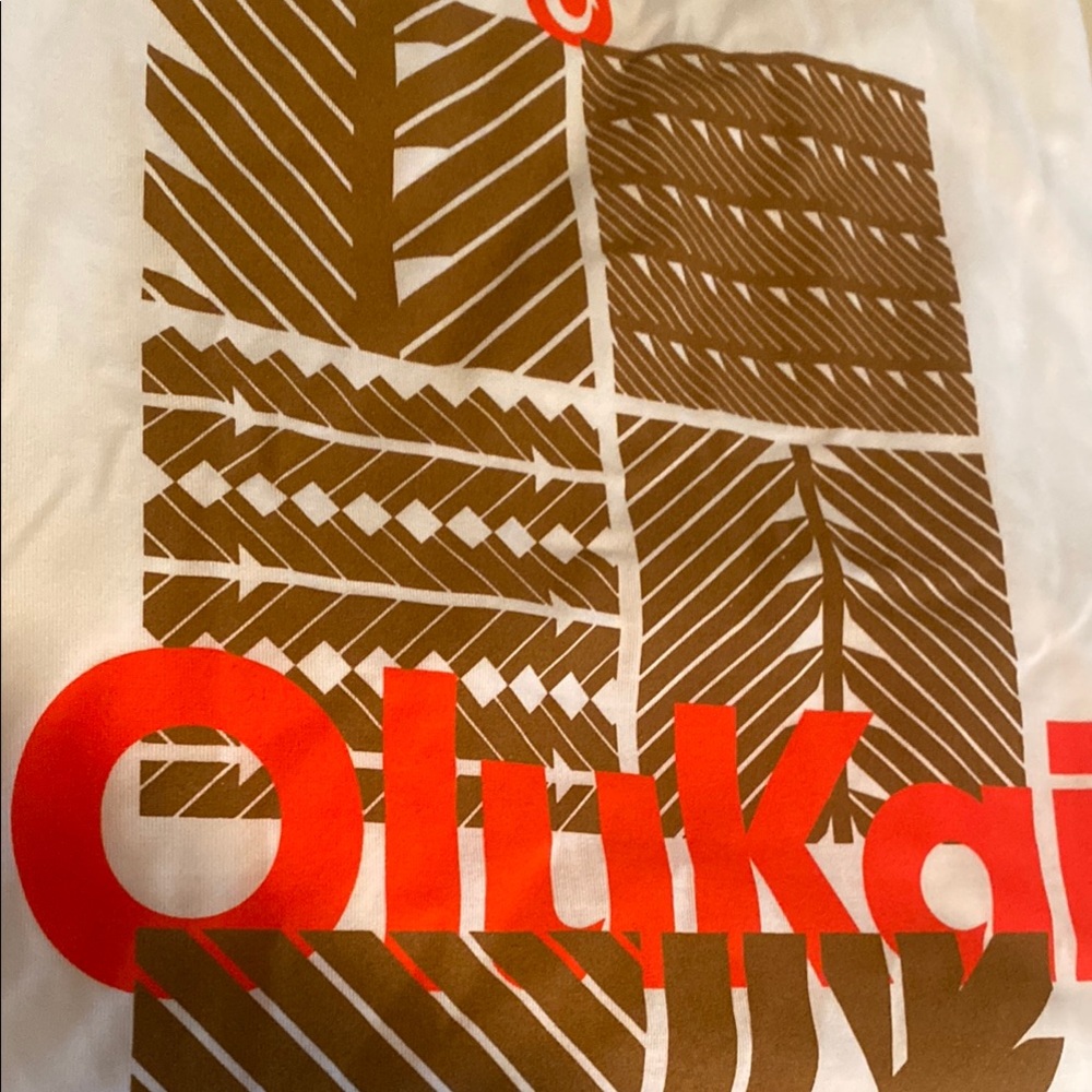 OluKai White Tee with Brown Patterns and Red Logo